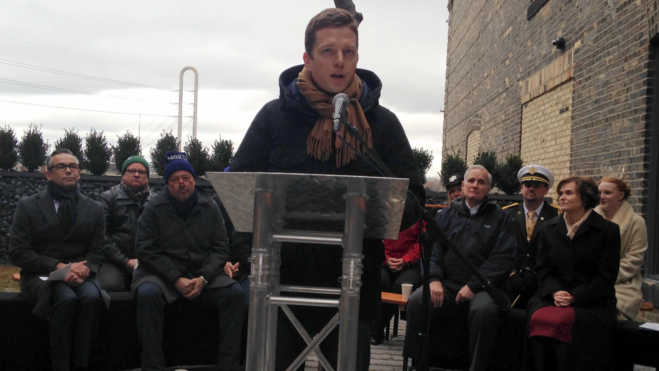 Eric Dayton (at the podium) announces The Great Northern Festival on Thursday, Dec. 1, 2016, next to his restaurant, The Bachelor Farmer, in Minneapolis. Seated behind Dayton (from left) are: Rick Gomez, senior vice president for marketing at Target; Steve Dietz of the Northern Spark arts festival; food and TV personality Andrew Zimmern; Gov. Mark Dayton; Winter Carnival King Boreas 2016 Jim Flaherty; Minneapolis Mayor Betsy Hodges and 2016 St. Paul Winter Carnival Queen of the Snows Alyssa Sigafus. (Pioneer Press: Kathy Berdan)