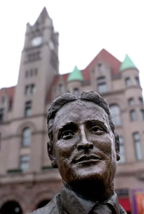 The Landmark Center looms over a statue of F.Scott Fitzgerald in Rice Park.