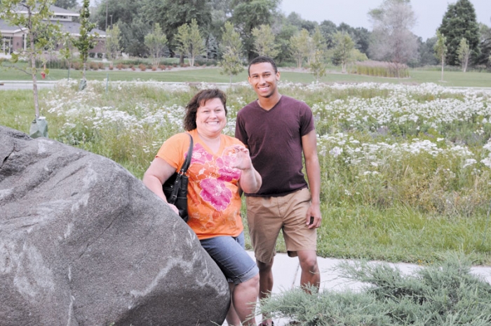 Winners after years of searching, Barbara Zitur and her son Reilly Page found the Oakdale Summerfest Medallion in the wood chips by the Tartan Crossing rock. (Linda Baumeister/Review)