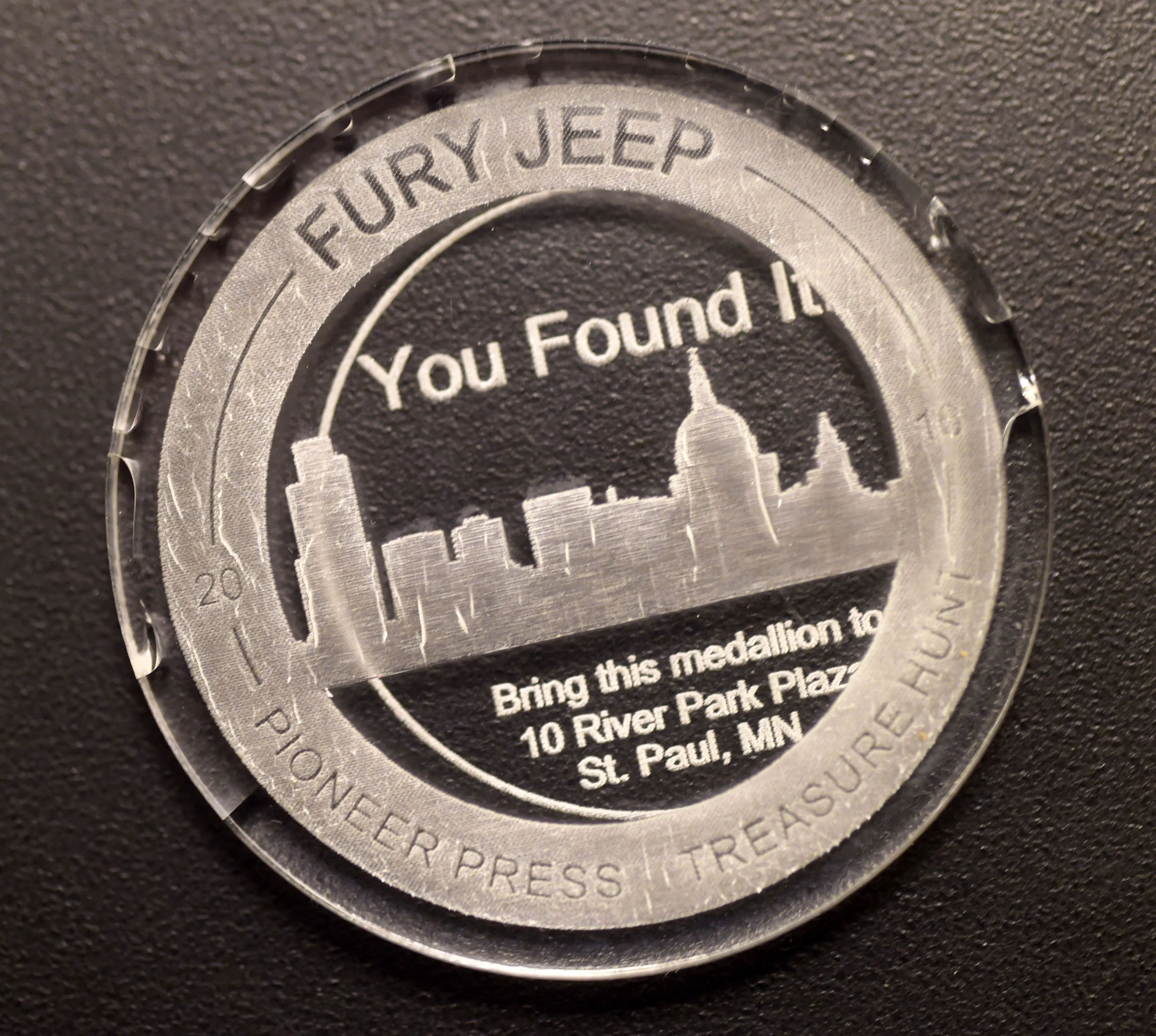 The Pioneer Press Treasure Hunt medallion was found in Bald Eagle-Otter Lake Regional Park by Heather Vocke, Christopher Jozwiak, and Phillip Kitzer, all of Minneapolis, late Wednesday, Feb. 3, 2016. (Pioneer Press: Scott Takushi)
