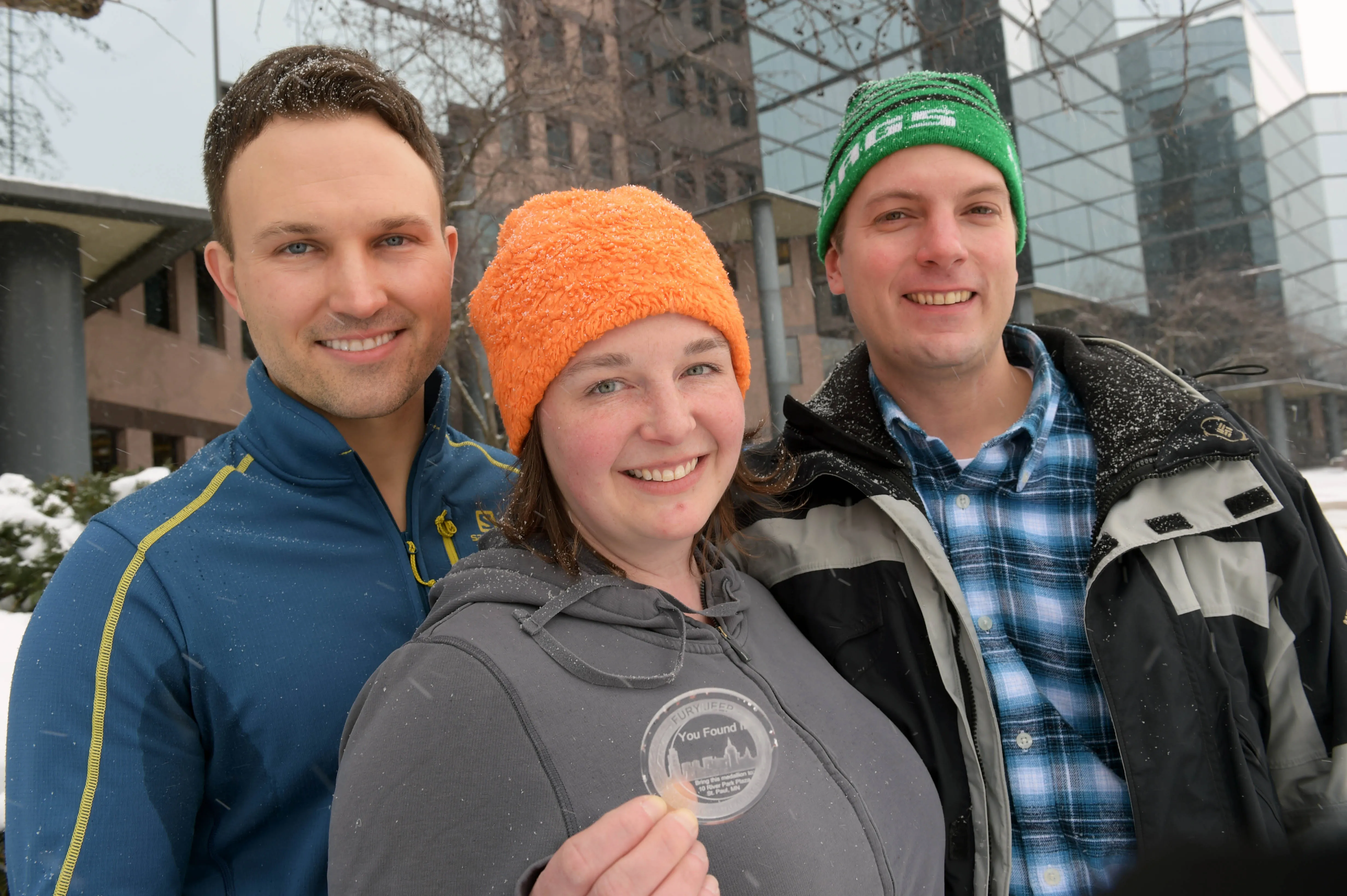 Pioneer Press Treasure Hunt winners, from left, Christopher Jozwiak, Heather Vocke and Phillip Kitzer, all of Minneapolis, show off their find outside the Pioneer Press headquarters on Thursday, Feb. 4, 2016. (Pioneer Press: Scott Takushi)