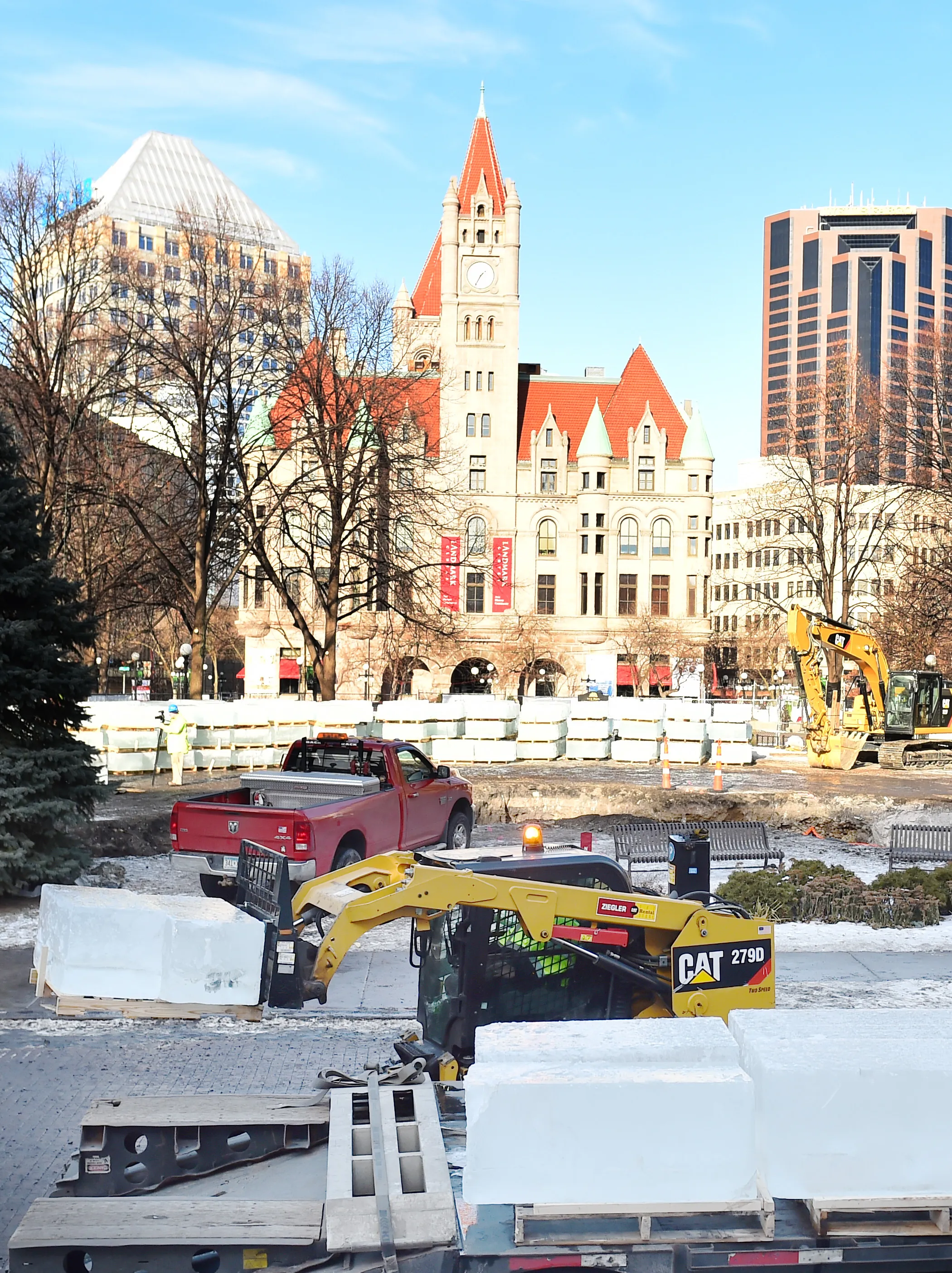 Park Construction Company workers unload 650-pound blocks of ice two at a time off a flatbed truck at the St. Paul Winter Carnival Ice Palace in Rice Park in St. Paul on Monday, Jan. 8, 2018. (Pioneer Press / John Autey)