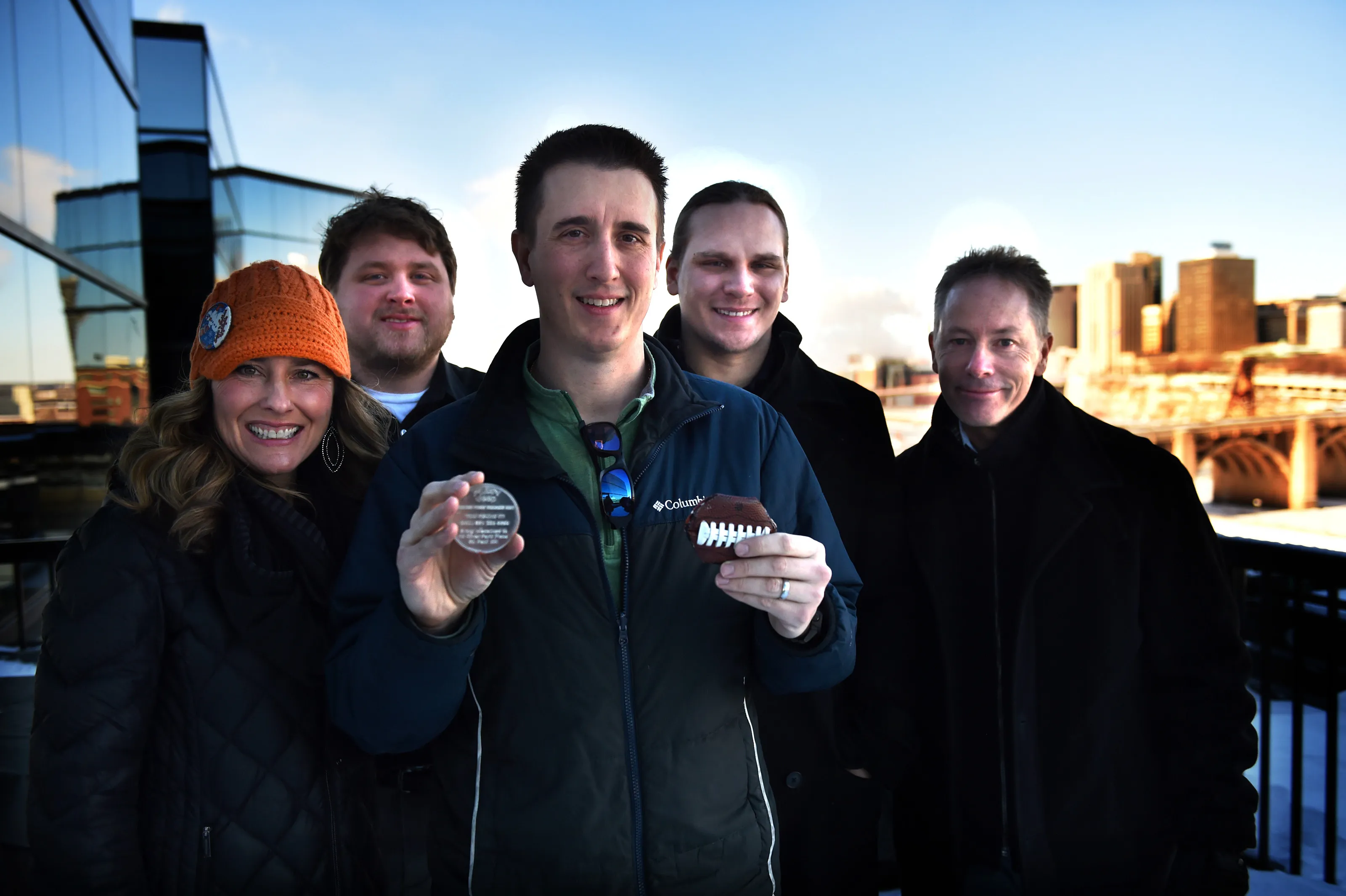Rob Brass, center, holds the medallion he found for the Pioneer Press Treasure Hunt Thursday, Feb. 1, 2018. The teammates he searched with are from left, Stacey King, Matt Koskie, Steven Sanftner and Steve Worthman. The medallion was found Wednesday night by the three-time winner. (Jean Pieri / Pioneer Press)