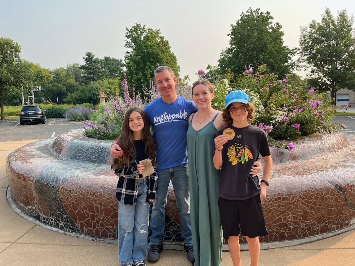Family poses with the found medallion