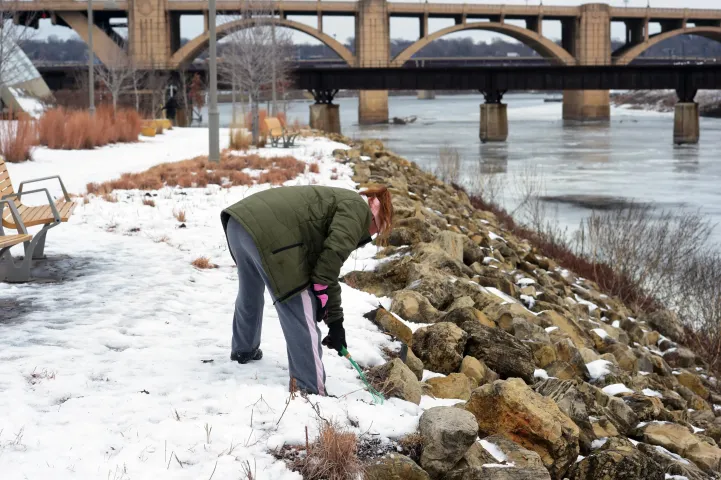 Winter Carnival treasure hunter Allison Jourdain searches for the medallion on Raspberry Island in St. Paul on Thursday, January 28, 2016. (Pioneer Press: Scott Takushi)