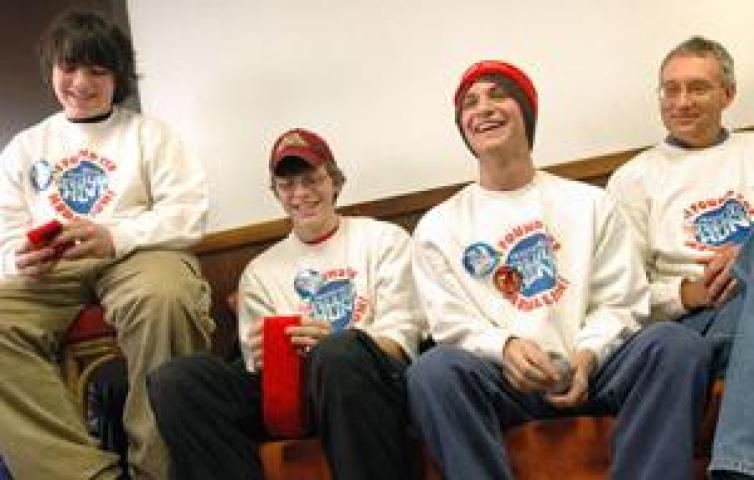 Medallion finders, from left, Ian Luby, 14; Kai Peterson, 15; Joe Barnard; and Kai's father Scott Peterson, talk to a Pioneer Pres reporter. (Pioneer Press: Ben Garvin)