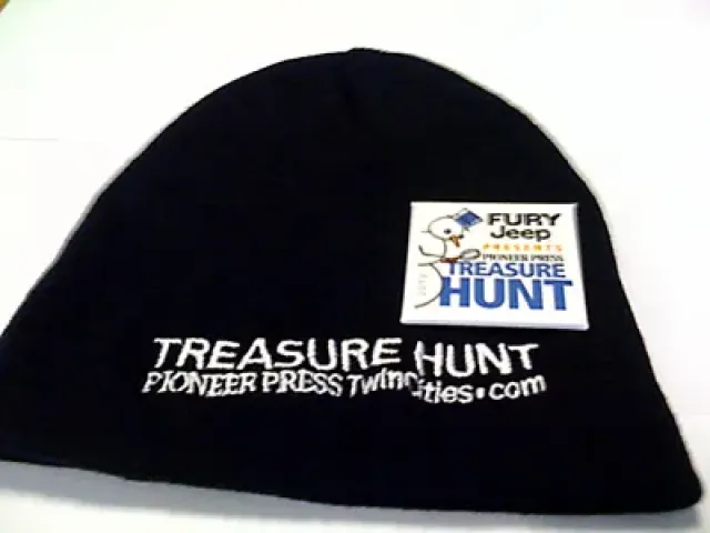 The official hat and button of the 2010 Fury Jeep Pioneer Press Treasure Hunt.