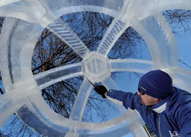 Chris Swarbrick of Richfield cleans up an ice sphere, part of his team’s entry, “Fountain of the Unicorns,” at Rice Park in St. Paul on Friday January 23, 2008. Judging for the Winter Carnival ice carving competiton takes place at the park on Saturday morning. (Pioneer Press: Richard Marshall)