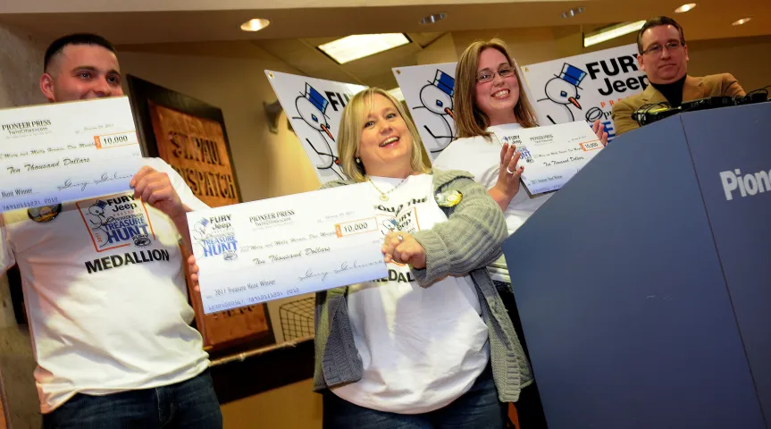 The 2011 Pioneer Press Treasure Hunt medallion winners answer questions during a press conference at the Pioneer Press on Saturday morning. The medallion was found at Battle Creek Regional Park by mother and daughter Mary, middle, and Molly Hermes, right, of Woodbury and Molly's boyfriend Dan Murphy, left, of St. Paul at 2:30 am Saturday morning. Pioneer Press Editor Thom Fladung, far right, watches after handing out checks to the trio. (Pioneer Press:Sherri LaRose-Chiglo)