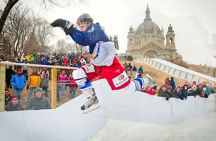 Martin Niefnecker of Germany soars over a double hump towards the end of the Crashed Ice Course during time trials in St. Paul, Minn., on Friday, January 13, 2012. (Pioneer Press: Ben Garvin)