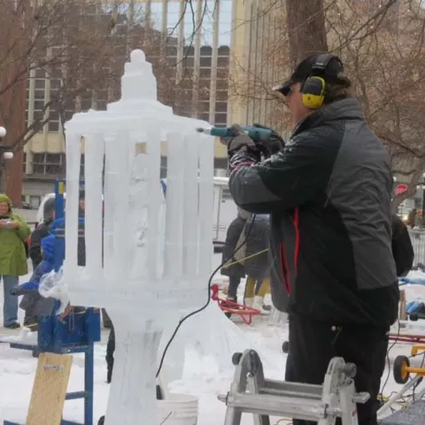 Greg Schmotzer of Hastings won first place in the Winter Carnival ice carving competition with his “Parrot in a Cage.” (Courtesy photo)