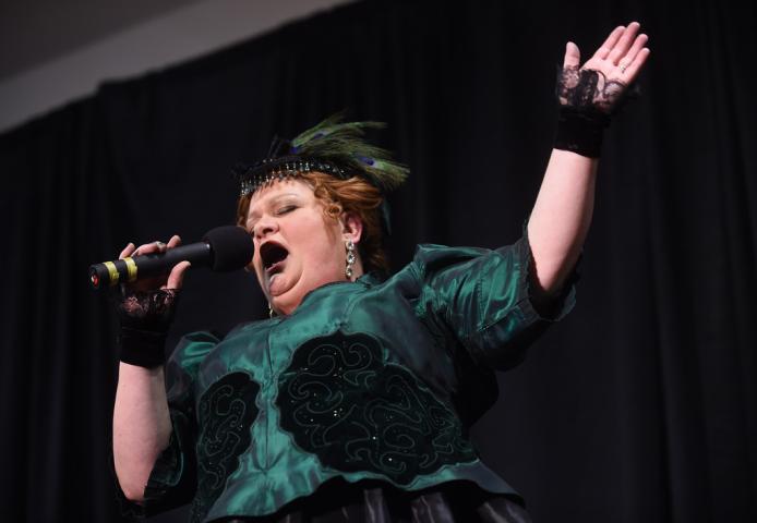 Theresa McConnon of St. Paul belts out a song as the Winter Carnival's Klondike Kate competition was held at the Prom Center in Oakdale, Wednesday night, January 13, 2016. (Pioneer Press: Scott Takushi)
