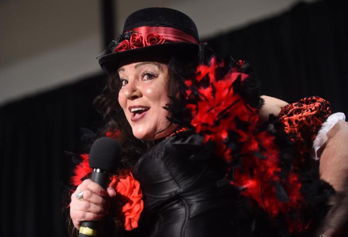Christine Christofore of Little Canada sings a bawdy song as the Winter Carnival's Klondike Kate competition was held at the Prom Center in Oakdale, Wednesday night, January 13, 2016. (Pioneer Press: Scott Takushi)