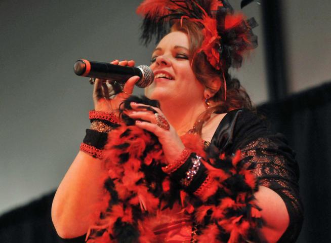 Kathy Rustin-Westphal of  Saint Paul Park performs in the second round of the Klondike Kate competition, part of the 128th St. Paul Winter Carnival, held in Oakdale Wednesday night,  January 8, 2014. Rustin-Westphal was named Klondike Kate for 2014.. (Pioneer Press: Scott Takushi)