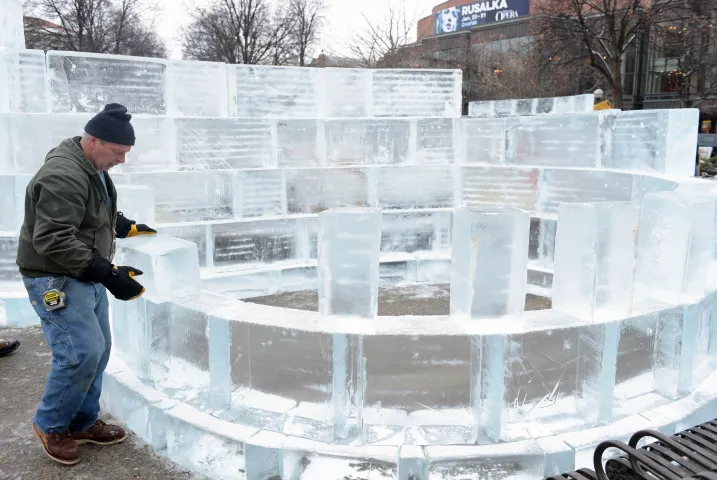 Joe Vanek of Hinckley helps build a round room on one side of the mini ice palace in Rice Park in downtown St. Paul, Sunday, January 24, 2016. (Pioneer Press: Scott Takushi)