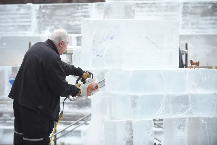 Rob Graham stacks up ice blocks for one of the Four Winds sculptures which will ring the mini ice palace in Rice Park in downtown St. Paul, Sunday, January 24, 2016. This West Wind sculpture will be a carving of a cowboy and horse. Carving of the sculptures has not begun because of the relatively warm weather. (Pioneer Press: Scott Takushi)