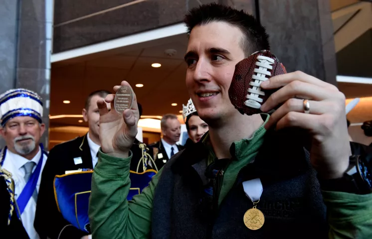 Rob Brass holds the medallion and what he found it in after a press conference for the Pioneer Press Treasure Hunt medallion winner Thursday, Feb. 1, 2018. The three-time winner found the medallion Wednesday night. (Jean Pieri / Pioneer Press)