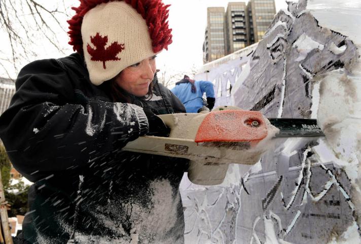 Derek Pasley, St. Paul, carves a rabbit on a sculpture called "Icechanted Forest" at the St. Paul Winter Carnival multi-block ice carving competition Friday January 24, 2014 in Rice Park in St. Paul. "It's very fun," said the first-year ice carver. "I do a lot of wood carving and I've carved marble. It's kind of a combination of the two," he said. (Pioneer Press: Jean Pieri)
