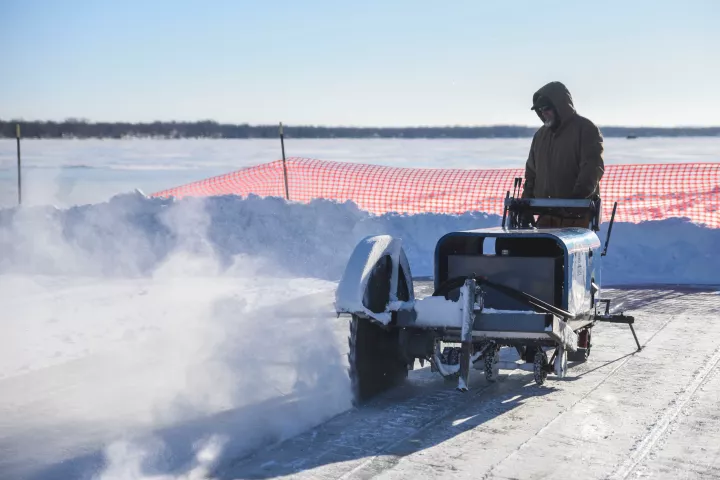 Gideon Doty cuts ice to be removed from Green Lake Wednesday in Spicer. (Erica Dischino / Forum News Service)