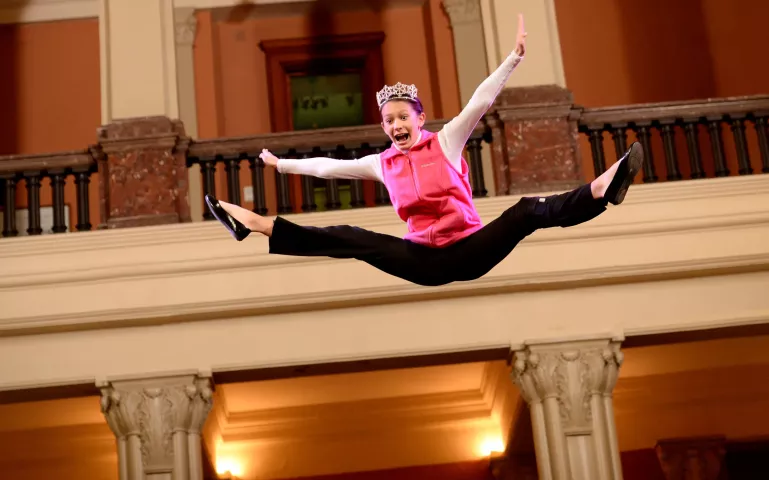 Sophia Hamann, St. Paul Winter Carnival Junior Princess of Ice takes a turn on the blanket during the St. Paul Bouncing Team tryouts at the Landmark Center in St. Paul on Friday, February 5, 2016. (Pioneer Press: John Autey)
