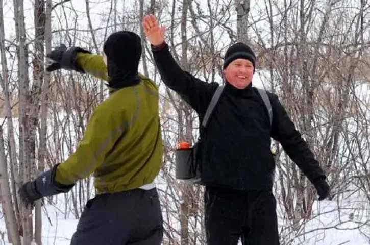 Chris Cook, left, and Chris Bratsch celebrate after Cook had a good throw during a game of disc golf with friends at Acorn Park in Roseville on Sunday, January 11, 2008. More than 50 disc golf players gathered at Acorn Park in Roseville for the fifth annual Fairway Freezer Ice Bowl, an event that raises money for a local human services agency. (Ben Garvin: Pioneer Press)
