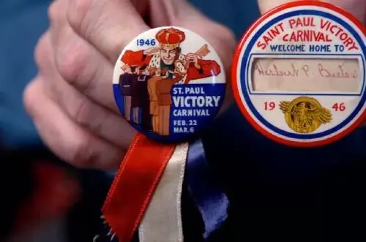 Howie Register holds buttons from 1946 when the Winter Carnival was called the St. Paul Victory Carnival after WWII. Howie Register (cq Howie), a collector of St. Paul Winter Carnival memorabilia, is in charge of the exhibit this year at the Landmark Center, January 21, 2009, (Jean Pieri, Pioneer Press)