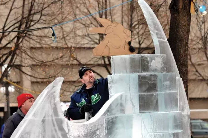 Greg Schmotzer, a chef at Treasure Island, tries to match both sides of a mountain lion's face during ice sculpting competition at Rice Park January 22, 2010. The sculpture he is working on is a mountain lion and two rams butting heads. He has been carving ice since 2000. (Greg's home phone 651-480-8723) (Pioneer Press: Jean Pieri)