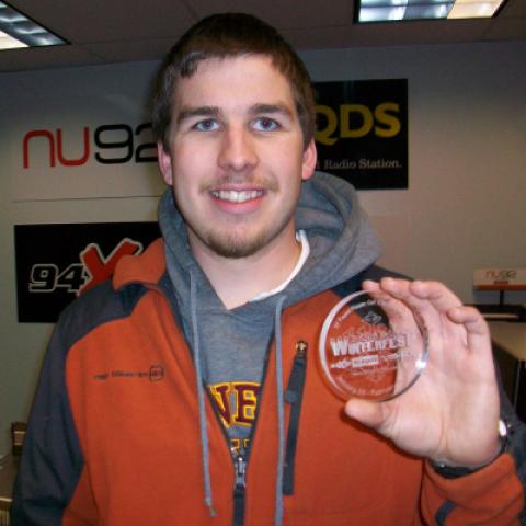 Dean Kuster of Duluth Holds the 2012 Medallion
