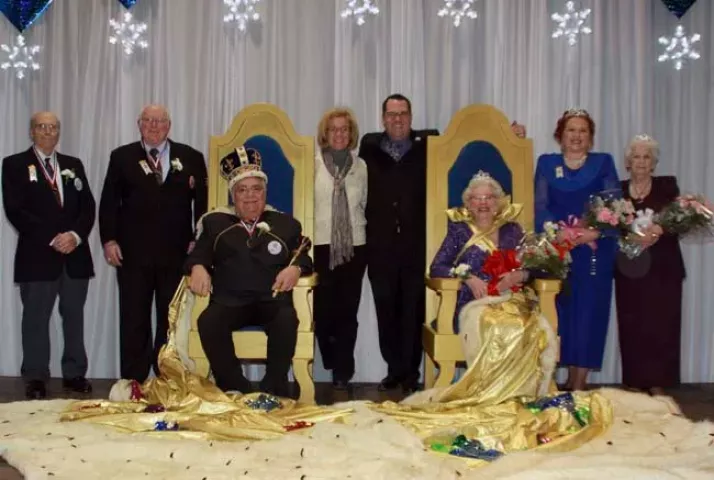Crowned Thursday night: Pete Koegel as King Winter the 54th and Ingeborg Ritt as Queen of the Northlands, both seated; Prime Minister Frank Gurney; Lady-in-Waiting Â­Bonnie Ripple; Prince of the Four Winds Nick Charles; and Princess of the Four Winds Marce Mlynarczyk. At center are Winter Carnival CEO Beth Pinkney and festival co-chairperson Rob Mauzy.