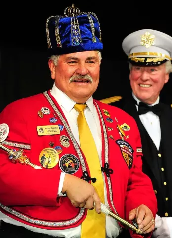 King Boreas Steve Cortinas (Boreas the 76th), VP/Plant Manager for Dakota Premium Foods in South Saint Paul, is crowned by last years King Boreas Keith LeBlanc of OlymPak Packaging (back right) at the Announcement and Coronation event as part of the Winter Carnival at St. Paul RiverCentre on Friday, January 27, 2011. (Pioneer Press: Ben Garvin)