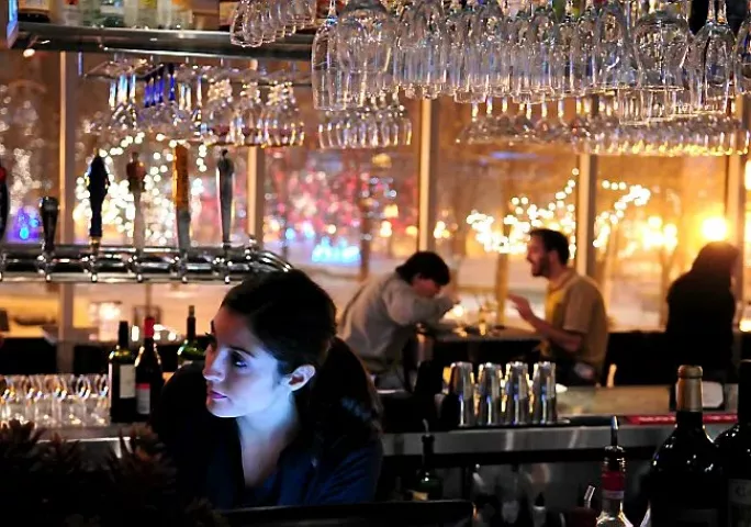Renae Miley, a bartender at Faces Restaurant, pauses while making drinks in St. Paul, Minn., on Friday, December 3, 2010. (Pioneer Press: Ben Garvin)