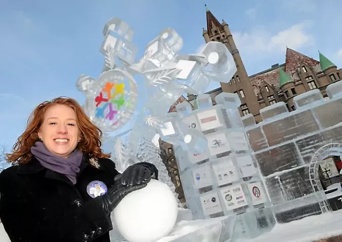Winter Carnival Board member Jennifer Tamburo, 31, from Afton at the ice throne in Rice Park with the logo for this years Winter Carnival and Landmark Center in the back on Wednesday morning January 22, 2014. (Pioneer Press: John Doman)