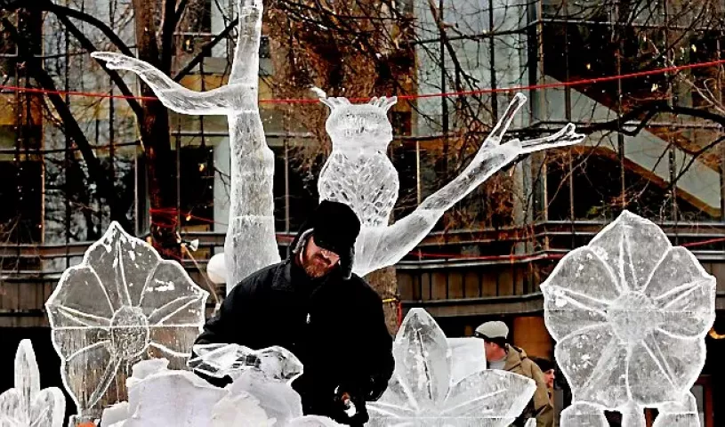 Derek Pasley, St. Paul, carves a rabbit on a sculpture called "Icechanted Forest" at the St. Paul Winter Carnival multi-block ice carving competition Friday January 24, 2014 in Rice Park in St. Paul. "It's very fun," said the first-year ice carver. "I do a lot of wood carving and I've carved marble. It's kind of a combination of the two," he said. (Pioneer Press: Jean Pieri)