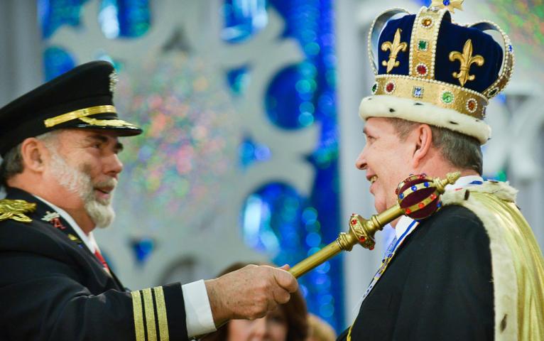 Making it official with a tap of the scepter, Greg Pluff, right, was crowned King Winter the 56th by last year's King Winter David Forsell during the Senior Royalty Coronation. (Pioneer Press: Ben Garvin)