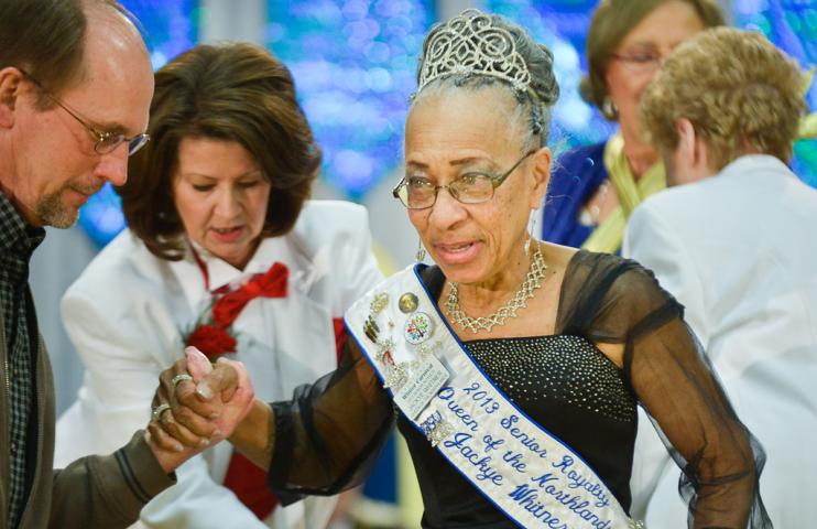 he outgoing 2013 Queen of the Northlands, Jackye Whitner, is helped off the stage at the conclusion of the Senior Royalty Coronation ceremony. (Pioneer Press: Ben Garvin)