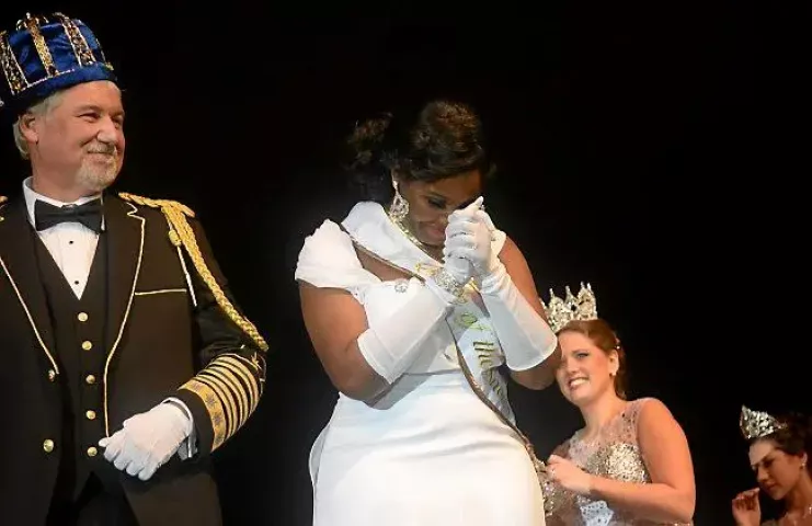Krystle Igbo-Ogbonna takes a moment after being crowned Aurora, Queen of the Snows during the St. Paul Winter Carnival Royal Coronation at the RiverCentre in St. Paul on Friday, January 23, 2015. Left of her is Boreas LXXVIX Daniel E. Stoltz. (Pioneer Press: John Autey)