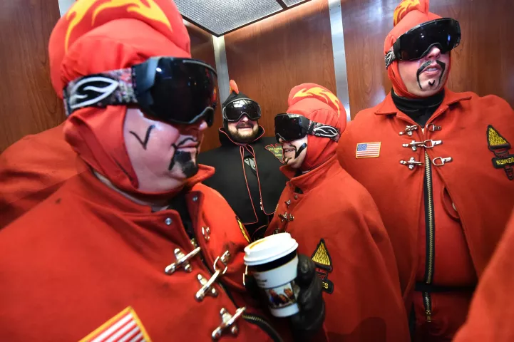 The Vulcans, including from left, John Hoeft, General Flameous; John Utermoehl, Vulcanus Rex; Jeff MacDonald, Count of Ashes; and Randy Graff, Duke of Klinker, take the elevator as the leave their hotel Wednesday. (Pioneer Press: Jean Pieri)