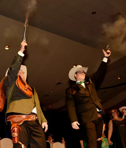 The outgoing Prince of the West Wind, Christian Weinhagen, right, fires his pistol with the new Zephyrus, Prince of the West Wind, Scott Oien the St. Paul Winter Carnival Royal Coronation at the St. Paul River Centre on Friday, January 29, 2016. (Pioneer Press: John Autey)