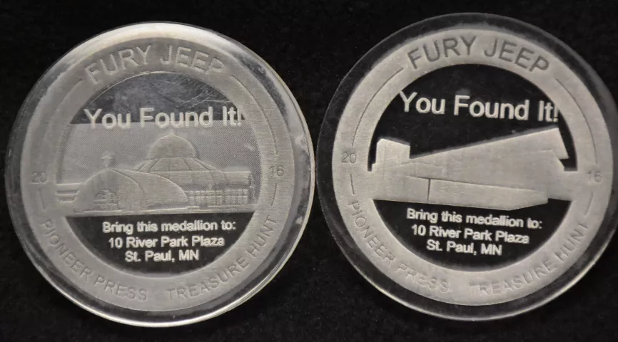 Two of the three Pioneer Press Treasure Hunt medallions struck in October of 2015 and bearing the year 2016 are pictured. The medallion on the left, featuring the Marjorie McNeely Nature Conservatory, was used in the 2017 hunt. At right is an unused medallion featuring CHS Field, where the St. Paul Saints play. (Pioneer Press: Dave Orrick)
