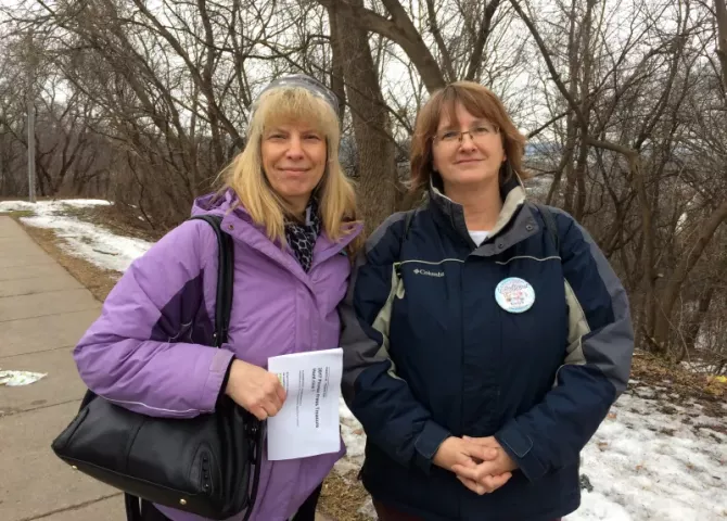 Treasure hunters Liz Hintze, left, and Sandy Moen prepare to scavenge for the 2017 Pioneer Press Treasure Hunt medallion around Indian Mounds park in St. Paul during their lunch break on Tuesday, Jan. 24, 2017. (Pioneer Press: Dave Orrick)