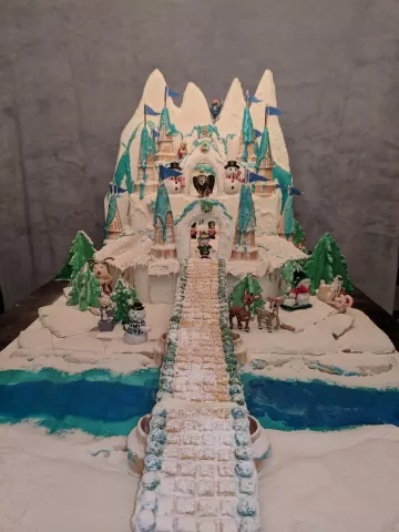 Writes Sydney Olsen of Plymouth: "Greetings. Come closer, and Welcome to King MoonRacers Ice Palace on The Island of Misfit Toys. As you can see we are having a party with the North Pole gang. Santa, Mrs. C., an Elf Foreman, Rudolf and Clarice. Sam the Snowman is chillin’ by the icy river with Charlie in-the-box, the sentry for the ice castle. Even Yukon Cornelius is coming late as he is pick axing for gold in our frozen mountains. Nutin’, because it is all edible… The mountains are Fondant on Rice Crispy t