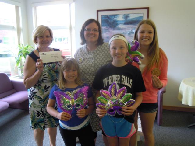 Medallion found by Mindy Anderson and daughters Julia, Stella &amp; Lydia at the Ellsworth Middle School on Thursday, June 19, after the fifth medallion clue was revealed!