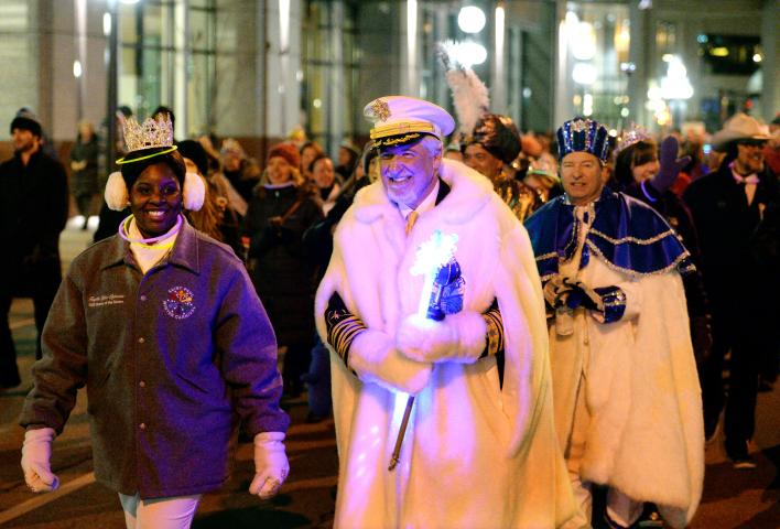 Aurora, Queen of Snows Krystle Igbo-Ogbonna and King Boreas Daniel E. Stoltz lead marchers during the St. Paul Winter Carnival Moon Glow Parade in St. Paul on Thursday, January 28, 2016, in their last official act before a new king and queen are crowned on Friday at the St. Paul RiverCentre. (Pioneer Press: John Autey)