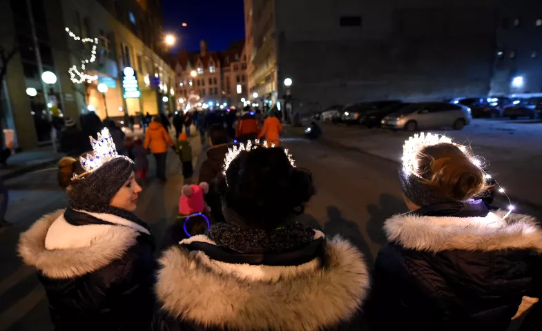 Marchers head up Sixth Street toward Rice Park during the St. Paul Winter Carnival Moon Glow Parade in St. Paul on Thursday, January 28, 2016. (Pioneer Press: John Autey)