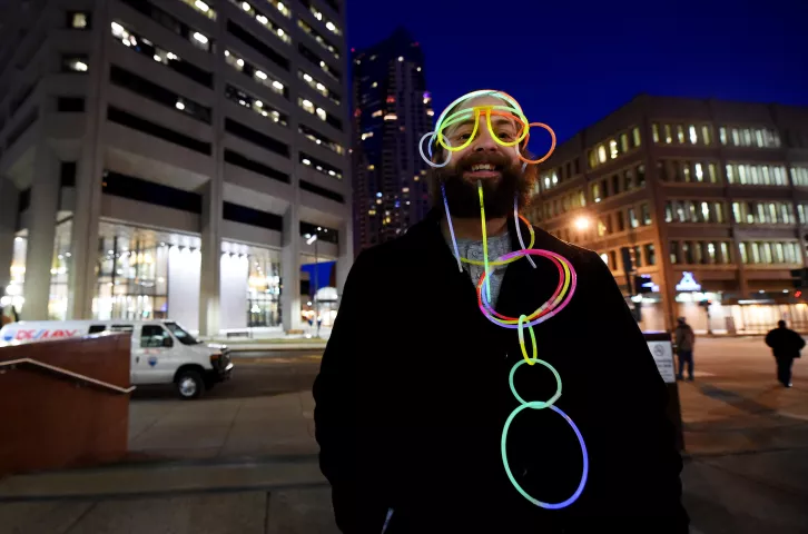 Marchers head up Sixth Street toward Rice Park during the St. Paul Winter Carnival Moon Glow Parade in St. Paul on Thursday, January 28, 2016. (Pioneer Press: John Autey)