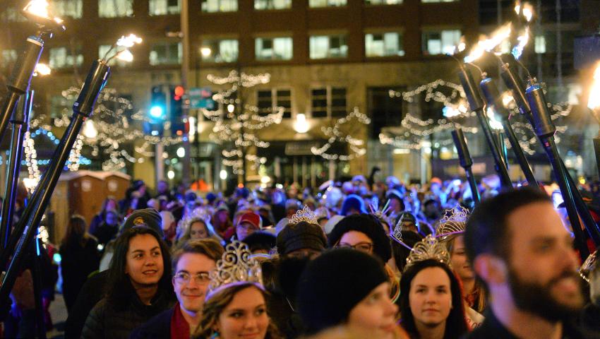 Marchers head up Sixth Street toward Rice Park during the St. Paul Winter Carnival Moon Glow Parade in St. Paul on Thursday, January 28, 2016. (Pioneer Press: John Autey)