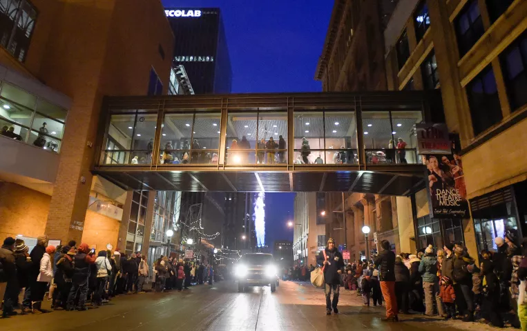 "Torches" -- propane burners from hot-air balloons -- light up Fifth Street and thrill those in the skyway above during the Winter Carnival Torchlight Parade, on Fifth Street in downtown St. Paul on Saturday, Feb. 6, 2016. (Special to the Pioneer Press: Craig Lassig)