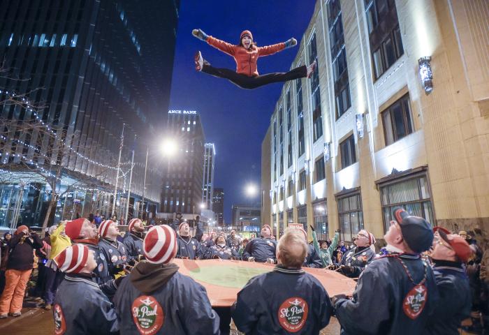 The St. Paul Bouncing Team performs during the Winter Carnival Torchlight Parade, on Fifth Street in downtown St. Paul on Saturday, Feb. 6, 2016. Inspired by an Eskimo hunting tradition, the bouncing team brings its acrobatics to social events year-round, but the Winter Carnival is the highlight; it’s the festival’s longest-running tradition. (Special to the Pioneer Press: Craig Lassig)