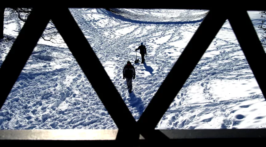 The tracks of Pioneer Press Treasure Hunt medallion hunters mark a creek depression at Lake Phalen Regional Park on Feb. 3, 2004. Hundreds of medallion hunters searched for the prize at the park. It was found there two days later, after the final clue was published. (Pioneer Press archives)