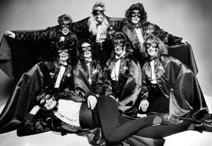 Some of the Vulcanettes pose for a portrait in costume on Jan. 21, 1991. They are, back row, from left: Kelly McDonough, Marlys Aukee and Jill Fiebiger; center row, from left: Mary Schaefer, Reenie McGrade, Carolee Swenson and M.J. Luna; front: Shelly Cylkowski. There are 16 Vulcanettes, alternately smudging city denizens. (Pioneer Press: Jean Pieri)